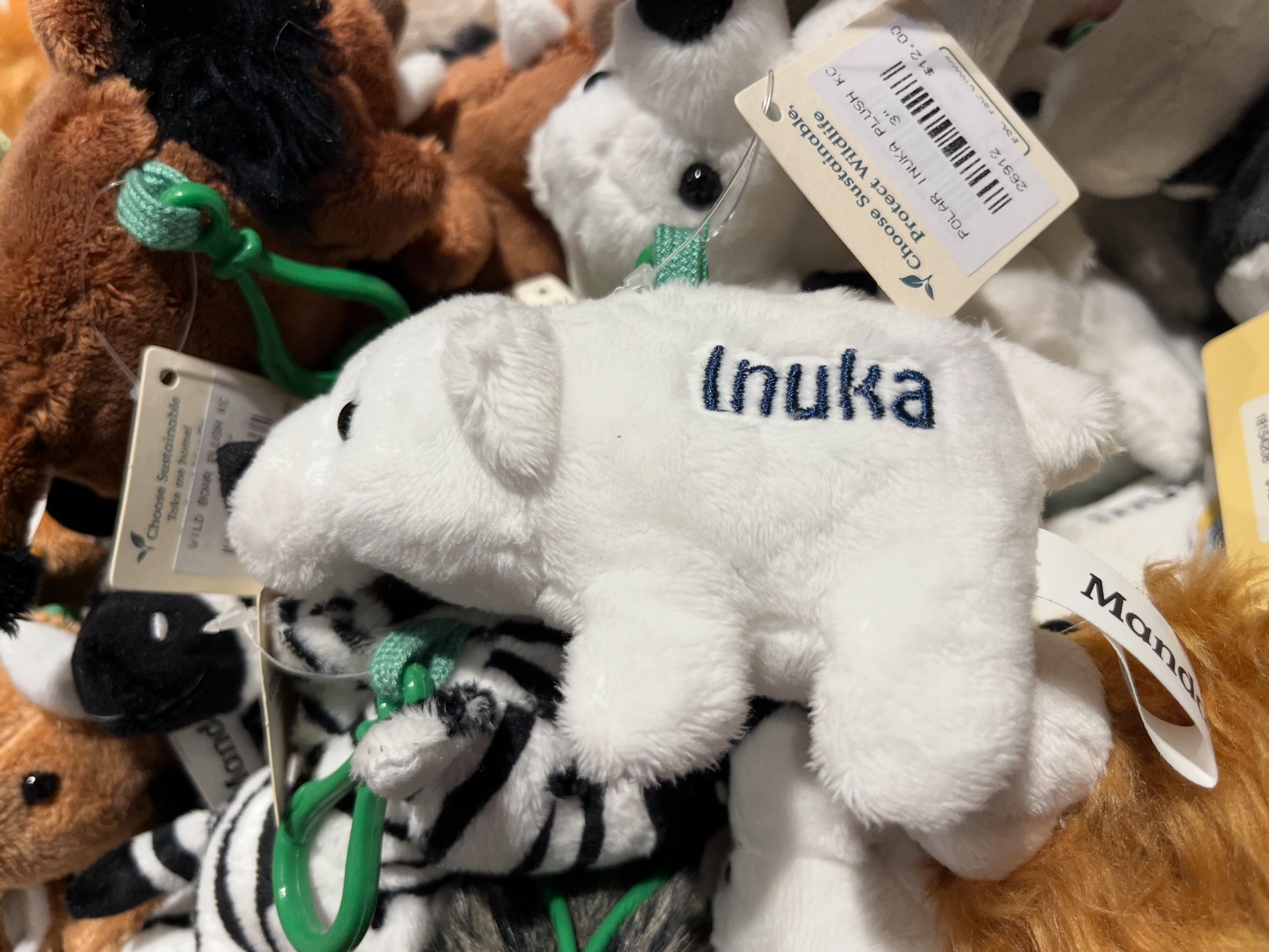 Plush polar bear keychain embroidered with the name Inuka